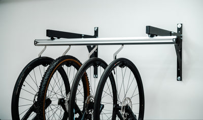 Four bikes on a SpaceRail wall mounted bike rack
