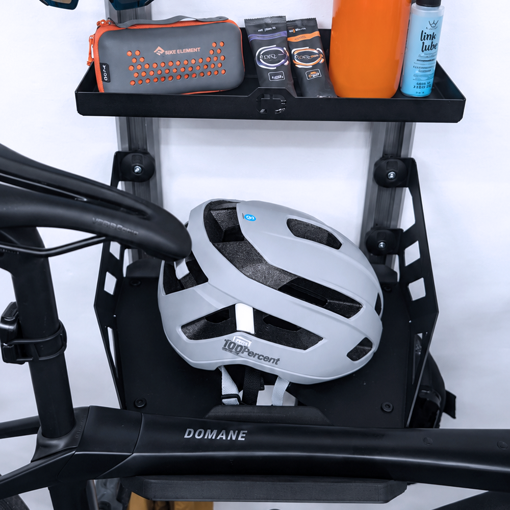 SpaceRail ONE Pro Set holding a road bike, with the accessory tray and hooks below