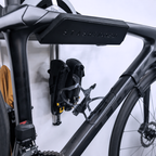 SpaceRail ONE Rail Mounted Pro Set holding a road bike by the frame