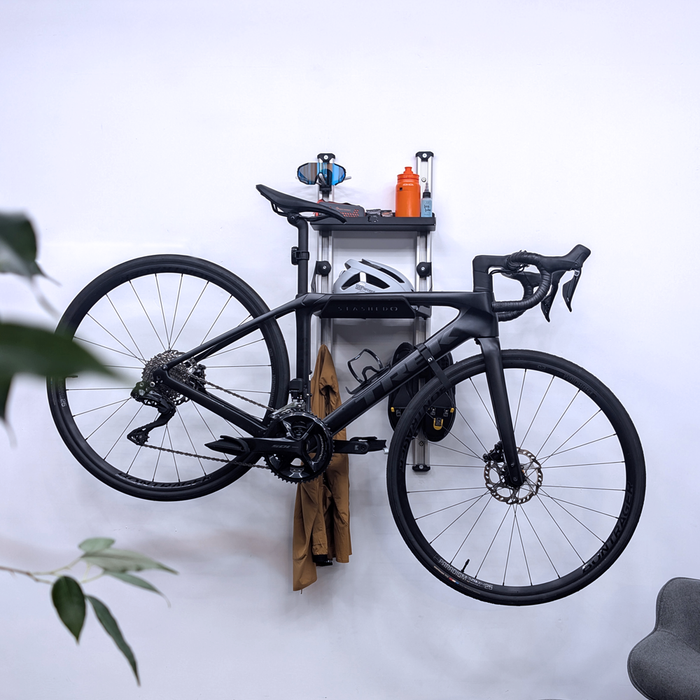 SpaceRail ONE Rail Mounted Pro Cycling Set holding a bike