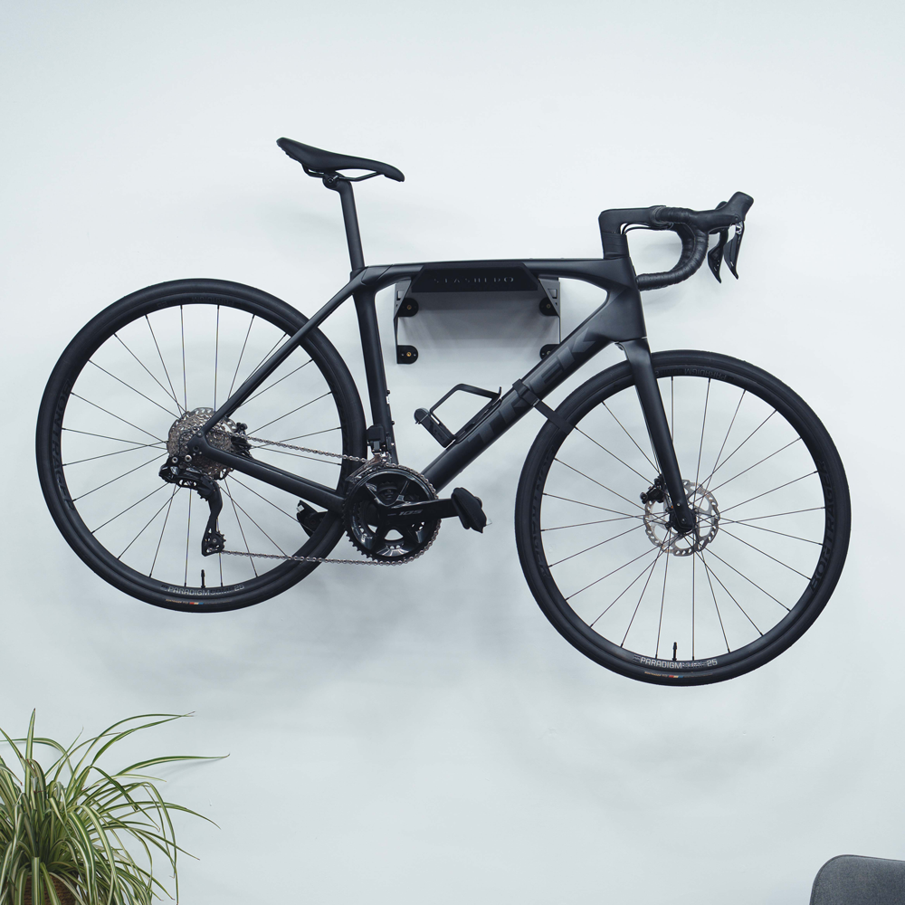 SpaceRail ONE bike wall mount holding a road bike by the top tube