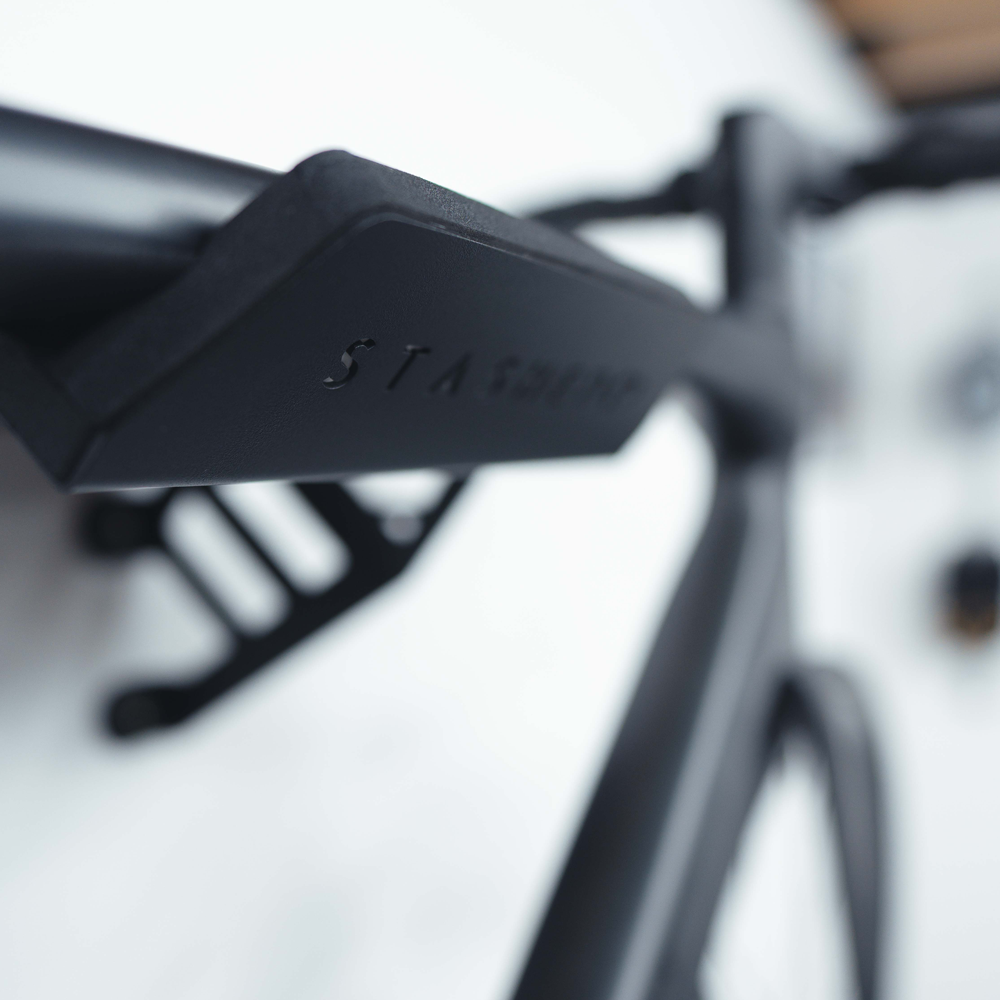 SpaceRail ONE bike wall mount fitted to a wall with a road bike in place