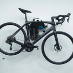 SpaceRail ONE bike wall mount with cycling kit on the hooks below the shelf