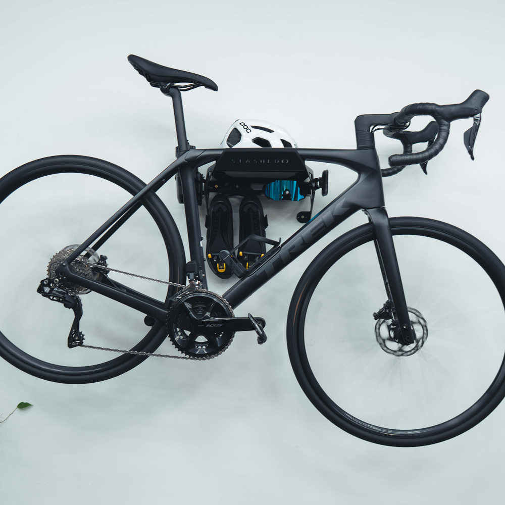 SpaceRail ONE bike wall mount with cycling kit on the hooks below the shelf