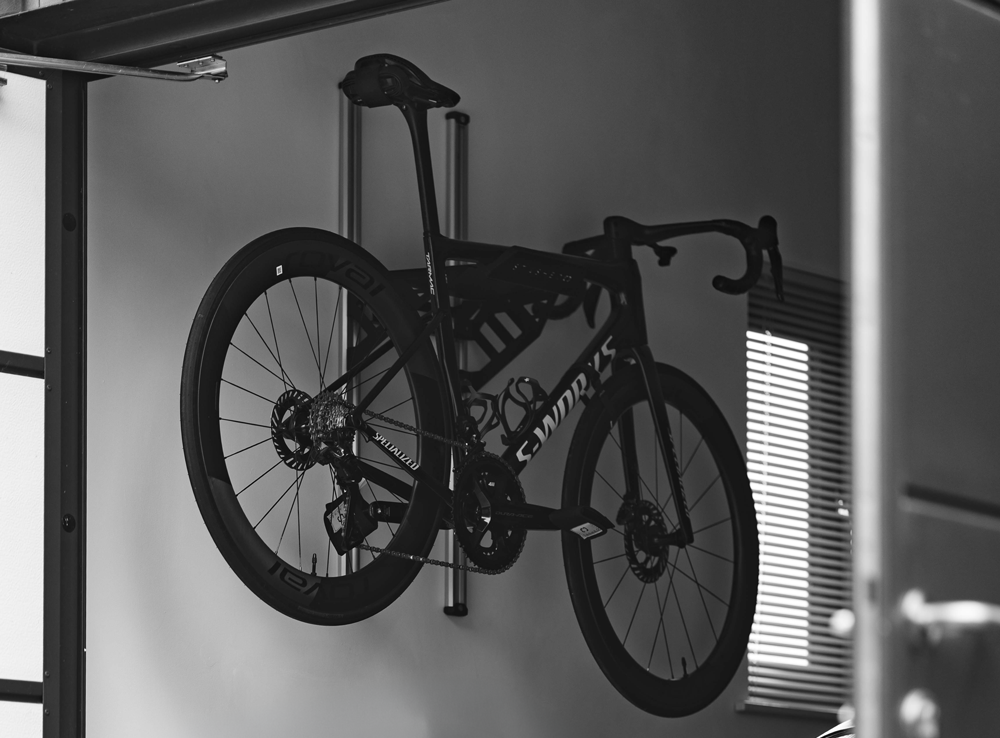 Road bike on the rail mounted SpaceRail ONE Starter Set, showing the full rail length