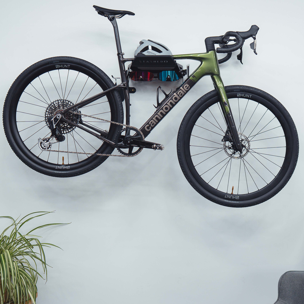 SpaceRail ONE bike station holding a road bike against a wall